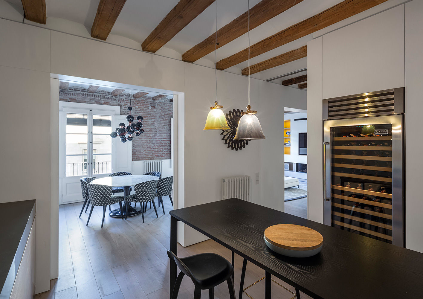 Modern Dining Room Features Brick Walls & Exposed Beams in Barcelona (1)